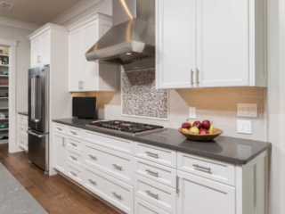 White kitchen cabinets with recessed panel doors