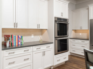 White kitchen cabinets with recessed panel doors