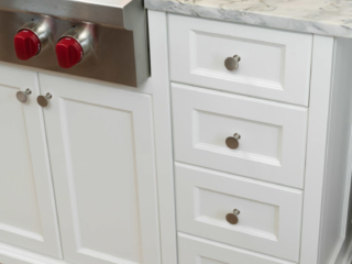 Bayfront Kitchen hardware on recessed panel drawer and door fronts.