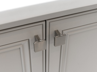 Jeffery Alexander Anwick Knob in Satin Nickel on beige painted doors with decorate recessed panels