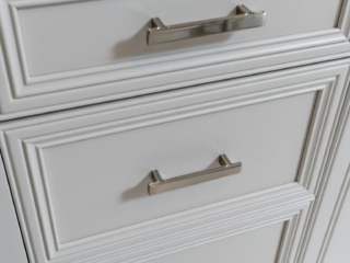 Jeffery Alexander Anwick Pull in polished chrome on inset bathroom vanity drawers with recessed panels